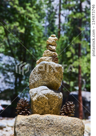Rock Cairn and Pine Cones in Sunlit Forest Nature Balance and Mindfulness Rock Cairn and Pine Cones in Sunlit Forest Nature Balance and Mindfulness 134973746