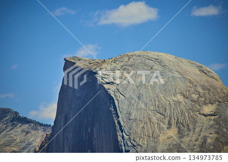 Half Dome Granite Formation with Blue Sky and Clouds in Yosemite National Park Half Dome Granite Formation with Blue Sky and Clouds in Yosemite National Park 134973785