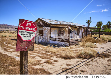 Abandoned Building and No Trespassing Sign in Sunny Yermo California Desert Abandoned Building and No Trespassing Sign in Sunny Yermo California Desert 134973820