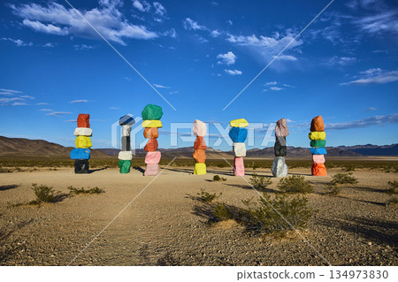 Seven Magic Mountains Colorful Rock Cairns in Nevada Desert Under Blue Sky Seven Magic Mountains Colorful Rock Cairns in Nevada Desert Under Blue Sky 134973830