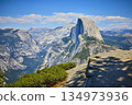 Half Dome Granite Cliffs and Forested Valley from Glacier Point in Yosemite 134973936