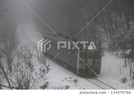A local train running through the morning mist A local train running through the morning mist 134974766