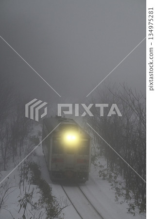 A local train running through the morning mist 134975281