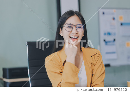 Business woman using calculator for do math finance on wooden desk in office and business working background, tax, accounting, statistics and analytic research concept. Business woman using calculator for do math finance on wooden desk in office and business working background, tax, accounting, statistics and analytic research concept. 134976220