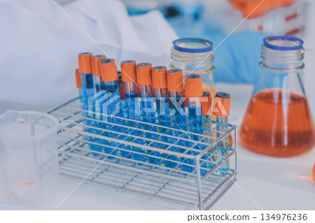 Portrait, science and happy woman on laptop in lab to research chemistry, test or innovation. Microscope, scientist and face of medical doctor in goggles for microbiology, healthcare or pharma study 134976236