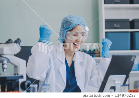 Portrait, science and happy woman on laptop in lab to research chemistry, test or innovation. Microscope, scientist and face of medical doctor in goggles for microbiology, healthcare or pharma study Portrait, science and happy woman on laptop in lab to research chemistry, test or innovation. Microscope, scientist and face of medical doctor in goggles for microbiology, healthcare or pharma study 134976252