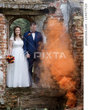 Wedding Couple Beside Rising Smoke Column 134977520