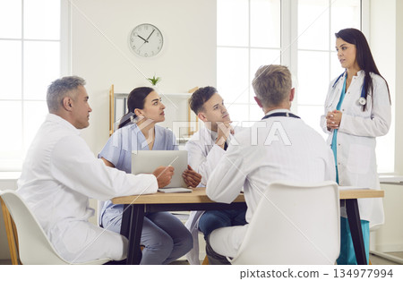 Team Of Doctors And Nurses In Group Meeting At Hospital Team Of Doctors And Nurses In Group Meeting At Hospital 134977994