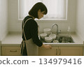 Indoor scene of a person feeling unwell in front of a sink 134979416