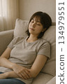 Indoor scene of a woman lying in bed and feeling tired 134979551