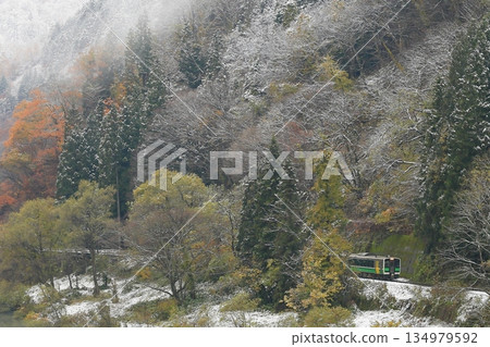 Tadami Line of autumn leaves and snow scene Tadami Line of autumn leaves and snow scene 134979592