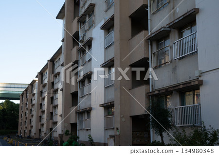 A dilapidated Showa-era apartment building, a housing complex built during the period of rapid economic growth A dilapidated Showa-era apartment building, a housing complex built during the period of rapid economic growth 134980348