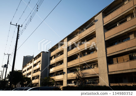 A dilapidated Showa-era apartment building, a housing complex built during the period of rapid economic growth A dilapidated Showa-era apartment building, a housing complex built during the period of rapid economic growth 134980352