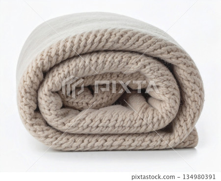 Light natural color. Rolled up comforter. Wool throw blanket on a white background. Minimalist luxury living room. 134980391