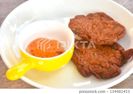 fried fish patty on plate dipping sweet chili sauce fried fish patty on plate dipping sweet chili sauce 134981453