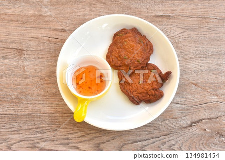 fried fish patty on plate dipping sweet chili sauce fried fish patty on plate dipping sweet chili sauce 134981454
