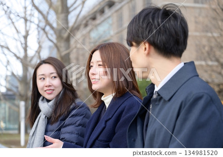Three men and women lined up in an office district 134981520