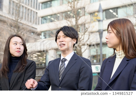 Three men and women lined up in an office district 134981527