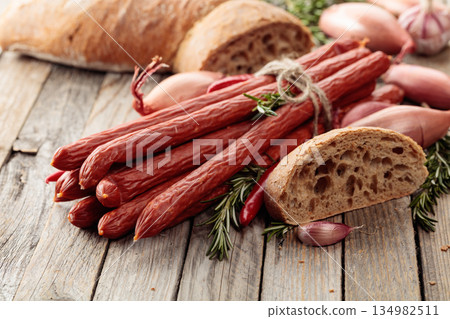 Smocked sausages with onion, garlic, pepper, and rosemary. Smocked sausages with onion, garlic, pepper, and rosemary. 134982511