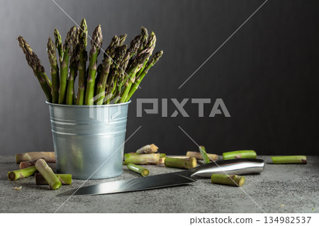 Fresh asparagus on a gray background. 134982537