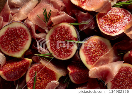 Prosciutto with rosemary and fig fruit. Prosciutto with rosemary and fig fruit. 134982556