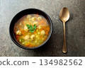 Classic meatball soup with potatoes,  carrot and greens. 134982562