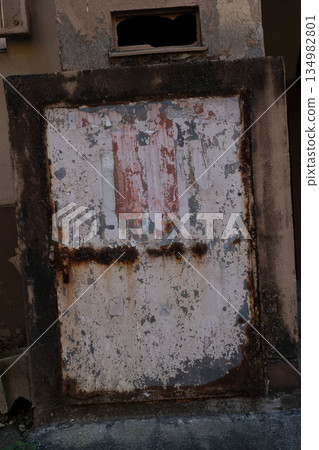 Garbage collection area of an old apartment building, dust chute door Garbage collection area of an old apartment building, dust chute door 134982801