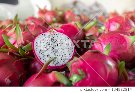 Dragon fruit that has been cut in half for product display. dragon fruit which are beautifully arranged in baskets to prepare for export sale. 134982814