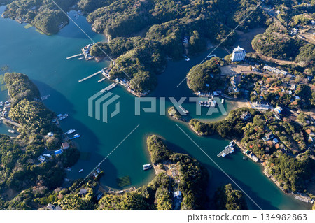 Aerial view of the emerald waterways and port town of Ago Bay 134982863