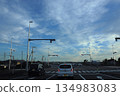 A scene of an intersection controlled by robot-like traffic light poles 134983083