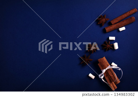 Sticks and stars of vanilla and marshmallows on a blue background. Sticks and stars of vanilla and marshmallows on a blue background. 134983302