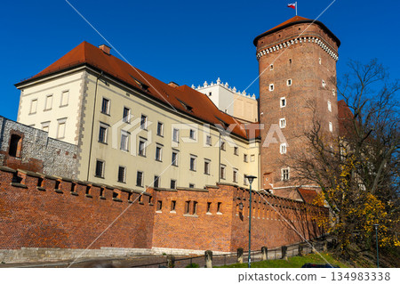 Poland flag on Wawel Castle in Krakow. Tower old building architecture Poland flag on Wawel Castle in Krakow. Tower old building architecture 134983338