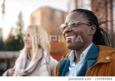 Diverse friends enjoying time outdoors in city 134984968