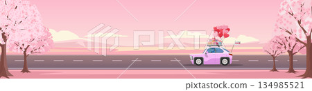 Romantic couple driving car with roof rack full of gifts and heart balloons. Road surrounded by blooming pink cherry blossoms. Valentine's Day travel concept with overall pink atmosphere. For banner. 134985521