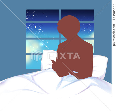 Man reading a book in bed silhouette window night Man reading a book in bed silhouette window night 134985536