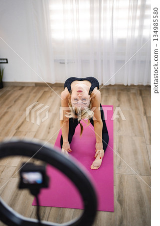 Finding peace in morning yoga practice 134985580