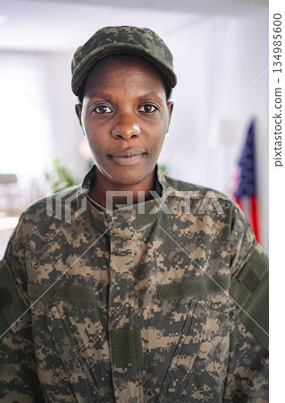 Confident african american female soldier looking at camera Confident african american female soldier looking at camera 134985600