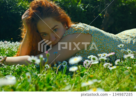red curly hair beauty girl outdoors at spring season red curly hair beauty girl outdoors at spring season 134987285