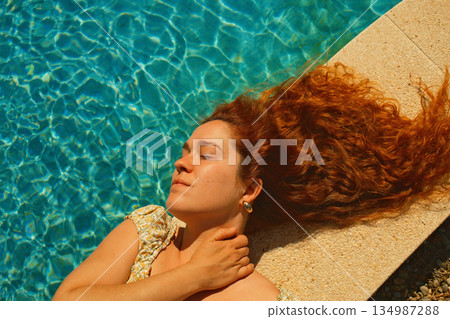 red curly hair beauty girl outdoors at spring season red curly hair beauty girl outdoors at spring season 134987288