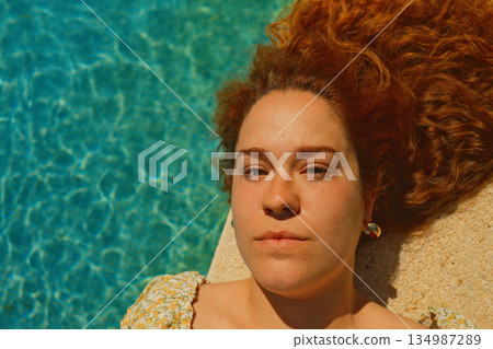 red curly hair beauty girl outdoors at spring season  134987289