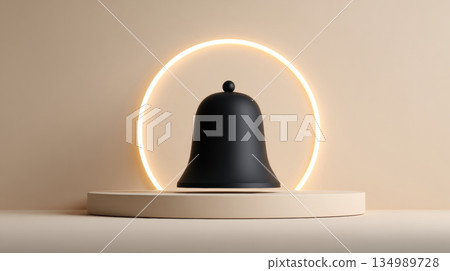 A black bell on a pedestal with an illuminated ring behind it 134989728