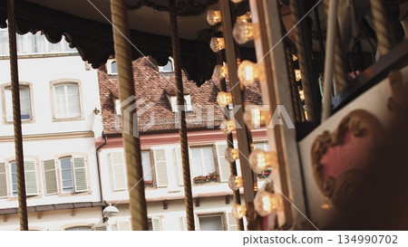 Ancient European city in France. Beautiful architectural monument shot close up with a rotating carousel, very exciting frame 134990702