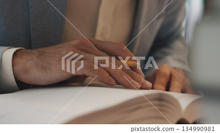 Businessman hands working in stacks of paper files for searching information on work desk office, business report papers,piles of unfinished documents achieves with clips indoor,Business concept. Businessman hands working in stacks of paper files for searching information on work desk office, business report papers,piles of unfinished documents achieves with clips indoor,Business concept. 134990981