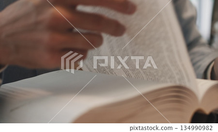 Businessman hands working in stacks of paper files for searching information on work desk office, business report papers,piles of unfinished documents achieves with clips indoor,Business concept. Businessman hands working in stacks of paper files for searching information on work desk office, business report papers,piles of unfinished documents achieves with clips indoor,Business concept. 134990982