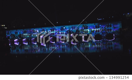 Very beautiful night laser show on the facade of the house. Beautiful laser and musical fountain show. 3D videomapping. Strasbourg, France. Very beautiful night laser show on the facade of the house. Beautiful laser and musical fountain show. 3D videomapping. Strasbourg, France. 134991254