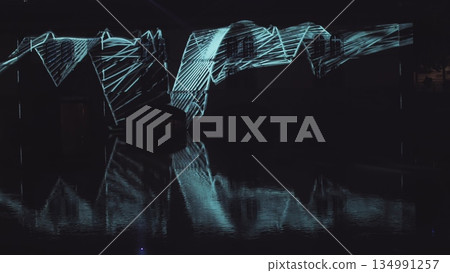 Very beautiful night laser show on the facade of the house. Beautiful laser and musical fountain show. 3D videomapping. Strasbourg, France. 134991257