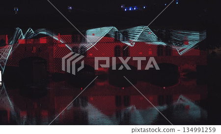 Very beautiful night laser show on the facade of the house. Beautiful laser and musical fountain show. 3D videomapping. Strasbourg, France. 134991259