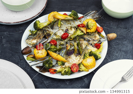 Grilled dorado fish with plums. Grilled dorado fish with plums. 134991315