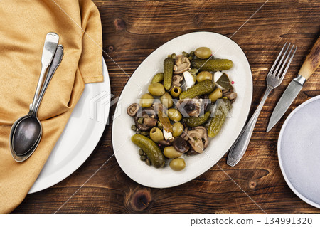 Marinated olives mushrooms and cucumbers, salted mushrooms Marinated olives mushrooms and cucumbers, salted mushrooms 134991320
