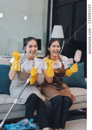 Cleaners clean empty office spaces Cleaners clean empty office spaces 134991425